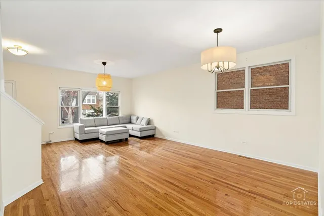 a large white kitchen with a large window