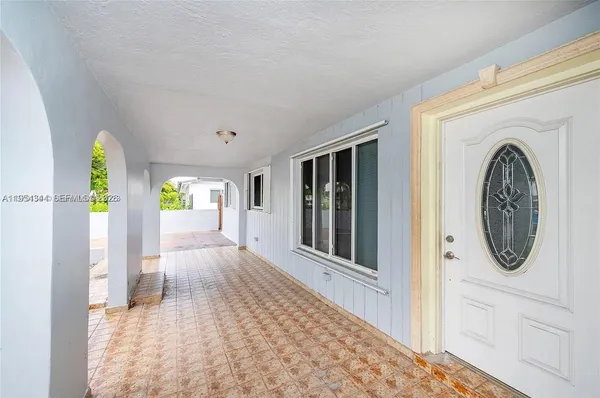 a view of a hallway with washer and dryer
