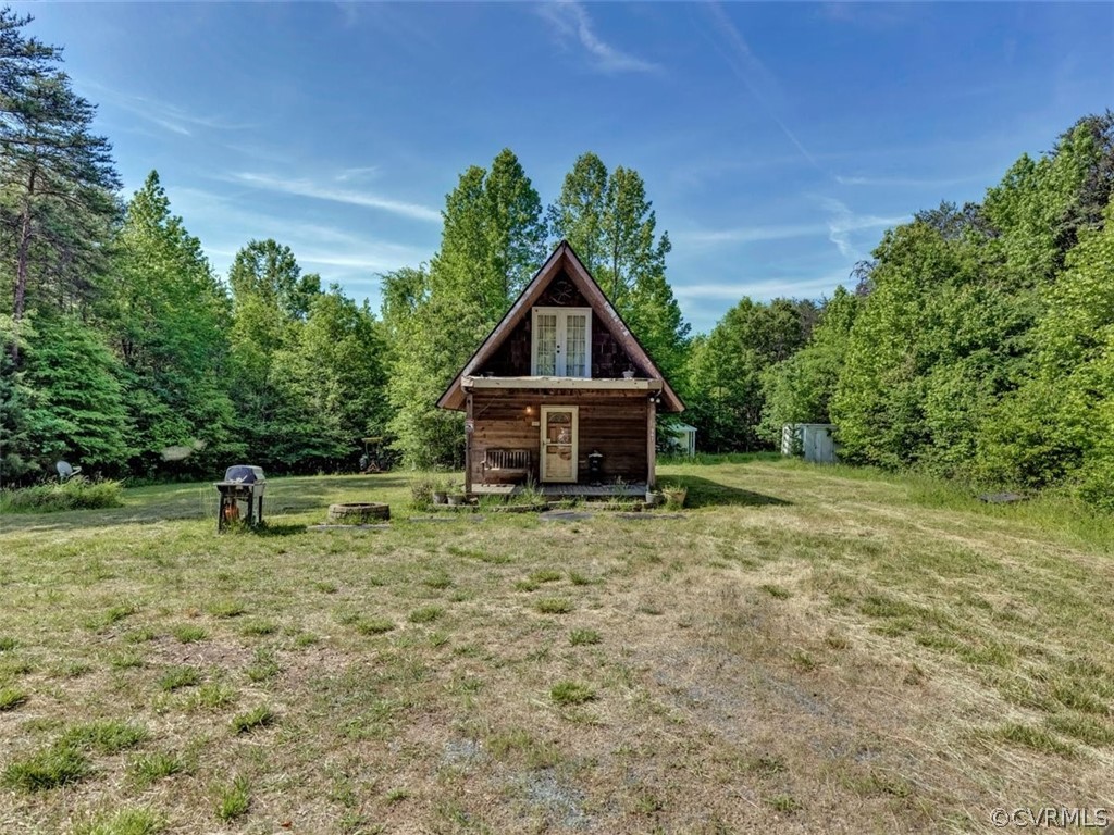 357 Belle Road Dillwyn, VA 23936 - Photo 3 of 29 a backyard of a house with table and chairs