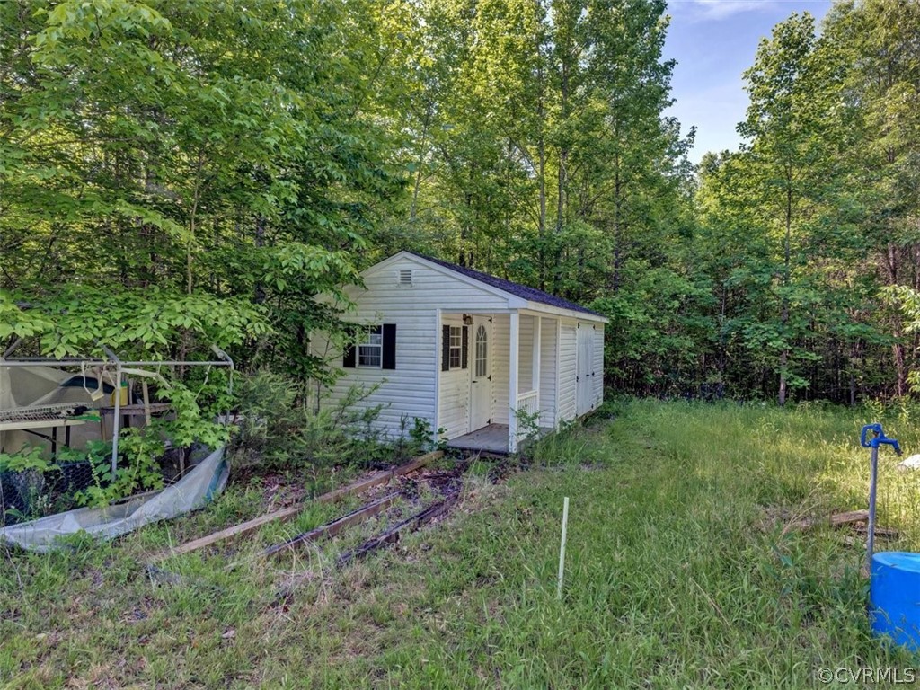 357 Belle Road Dillwyn, VA 23936 - Photo 5 of 29 a house view with a backyard space