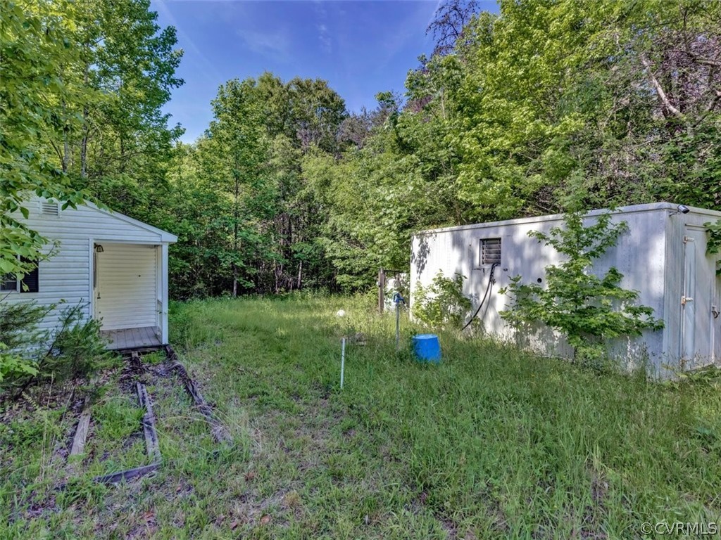 357 Belle Road Dillwyn, VA 23936 - Photo 6 of 29 a backyard of a house with lots of green space