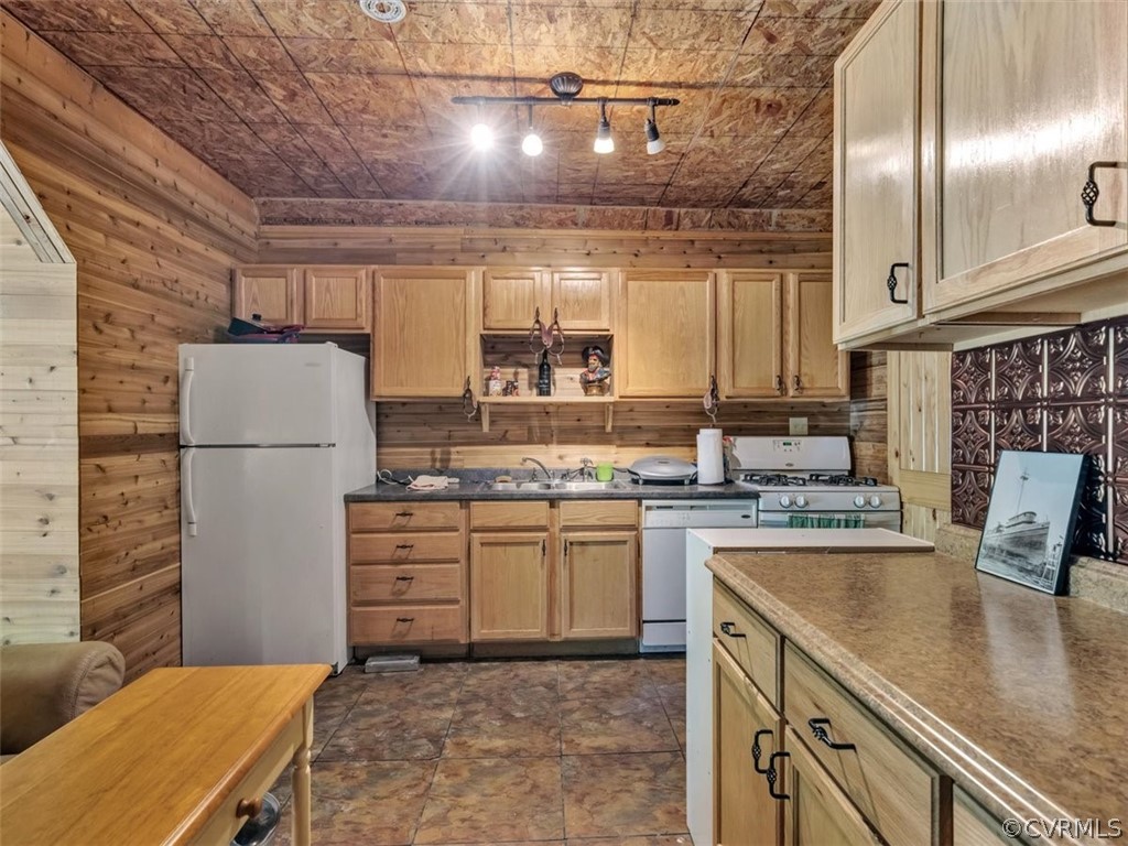 357 Belle Road Dillwyn, VA 23936 - Photo 10 of 29 a kitchen with kitchen island a stove a sink and a refrigerator