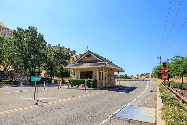 a view of a dry yard with mountains