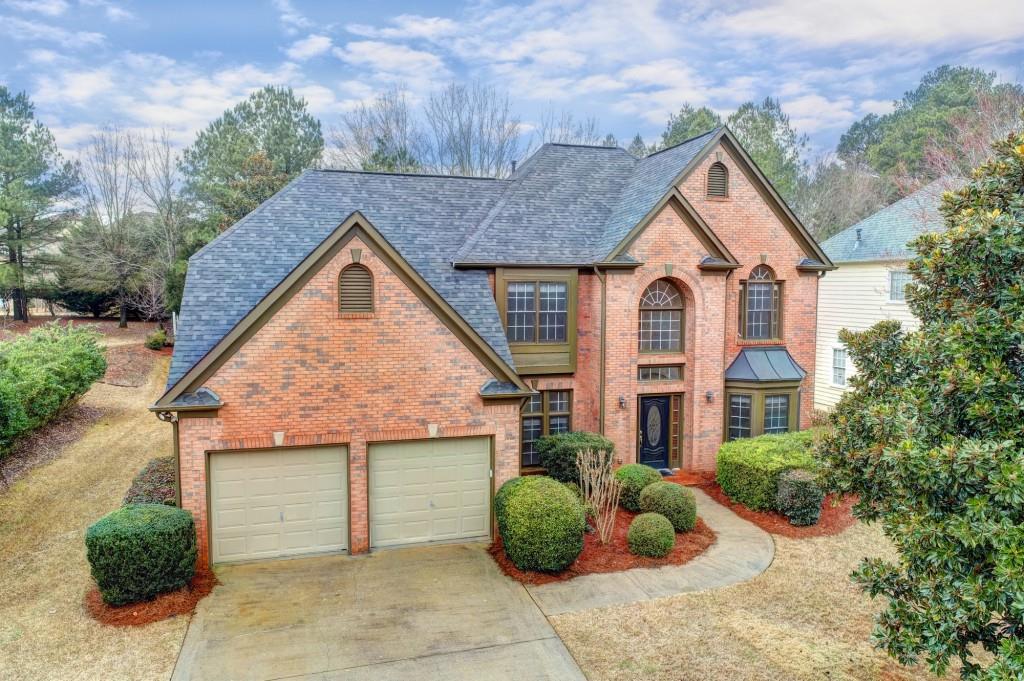 455 Lahontan Pass Suwanee, GA 30024 - Photo 1 of 1 a view of a house with backyard and garden