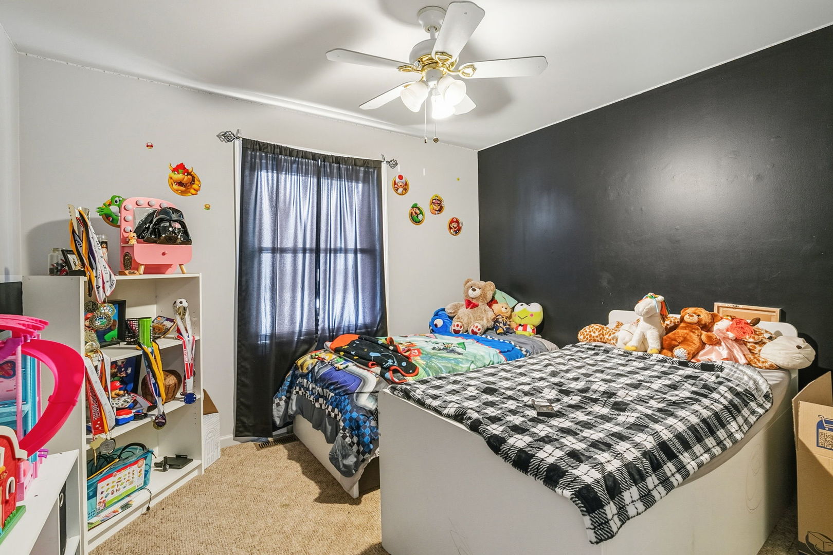 3668 Grandview Avenue Gurnee, IL 60031 - Photo 12 of 25 a bedroom with bed and a chandelier