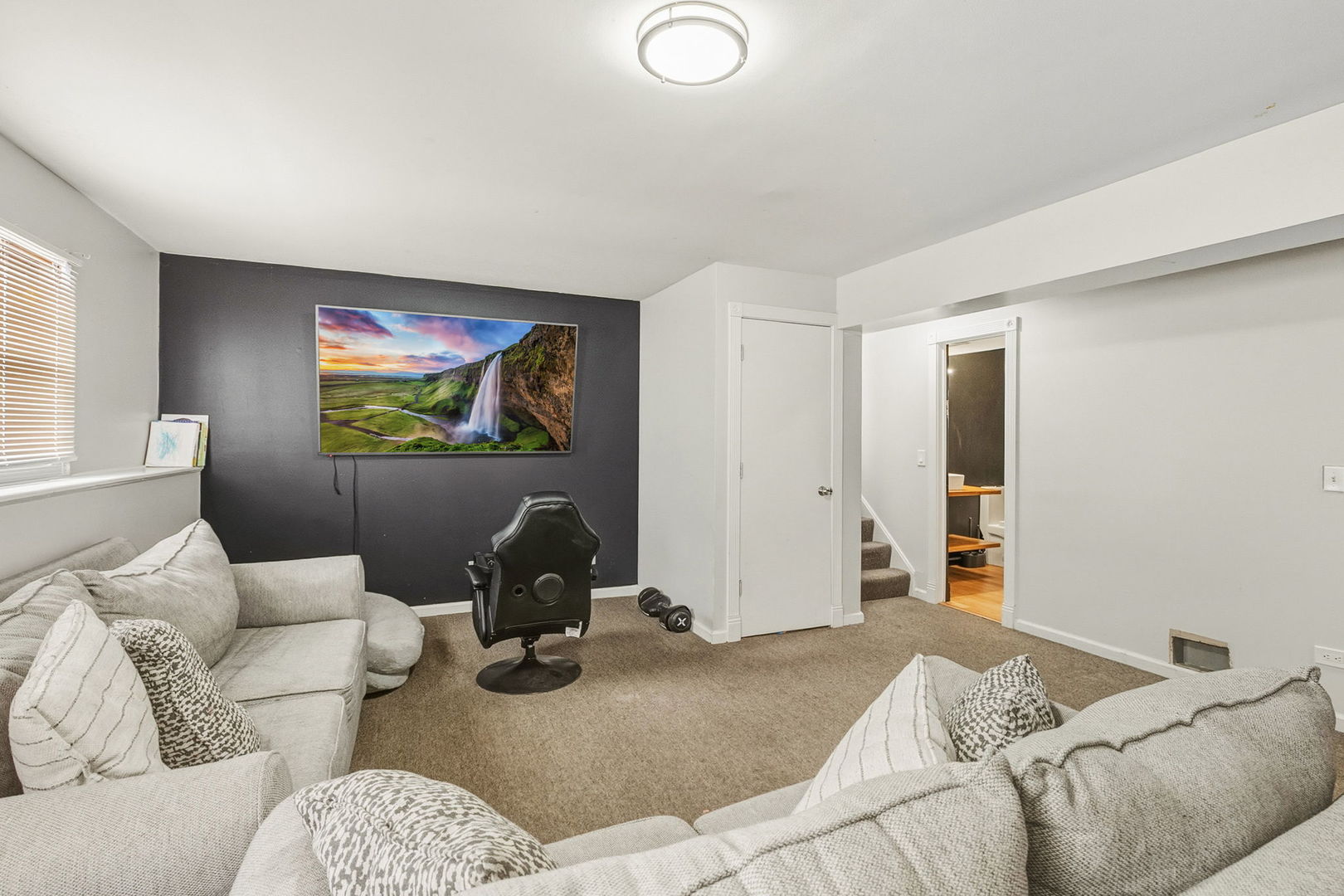 3668 Grandview Avenue Gurnee, IL 60031 - Photo 16 of 25 a living room with furniture and a flat screen tv