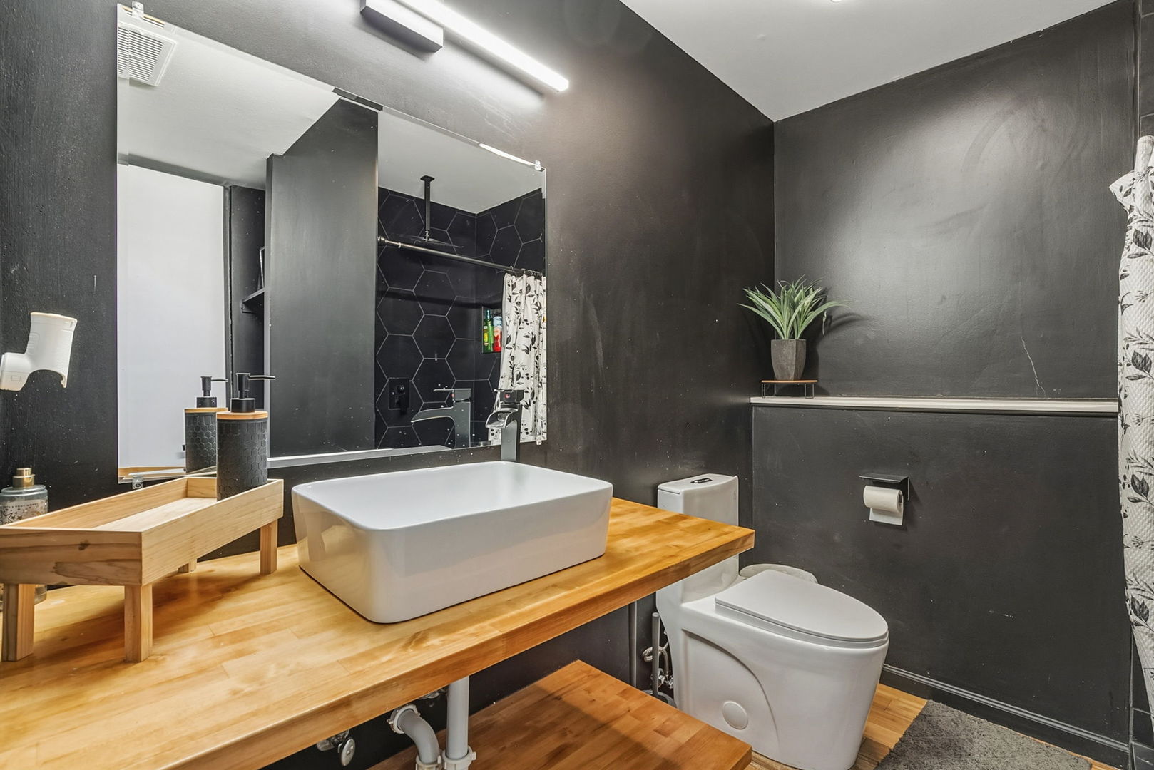 3668 Grandview Avenue Gurnee, IL 60031 - Photo 18 of 25 a bathroom with a sink a toilet and a mirror