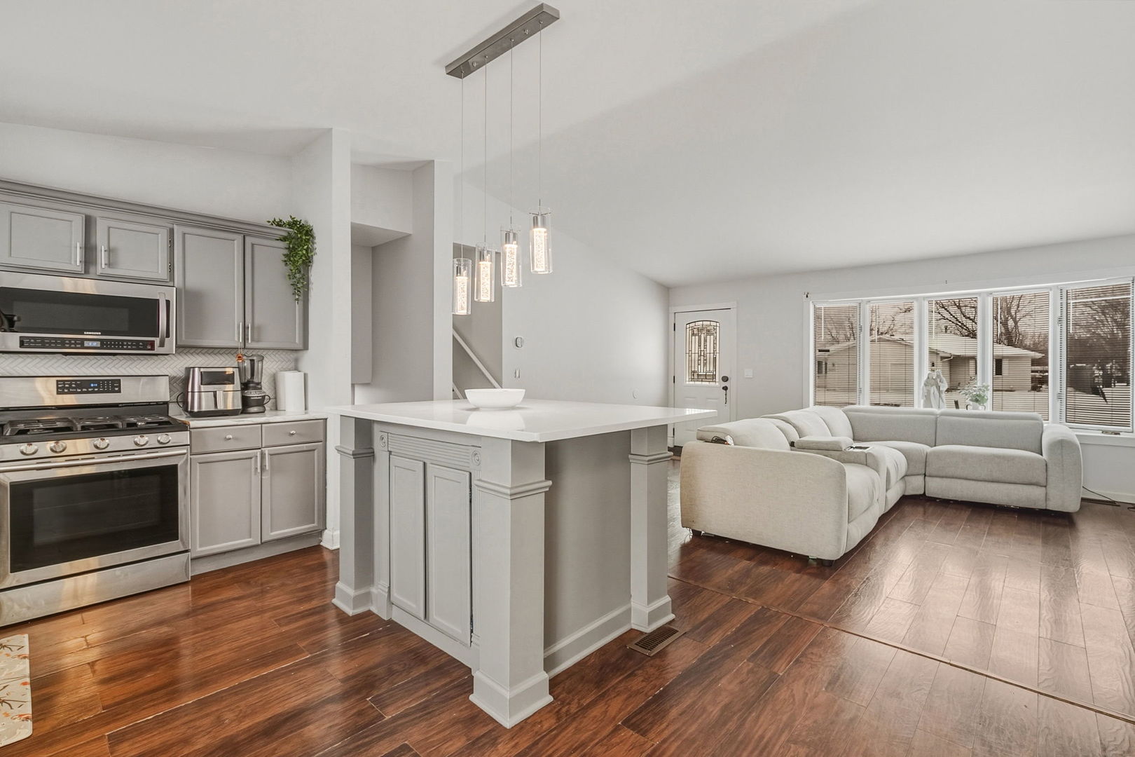 3668 Grandview Avenue Gurnee, IL 60031 - Photo 7 of 25 a kitchen with kitchen island granite countertop a stove and a sink