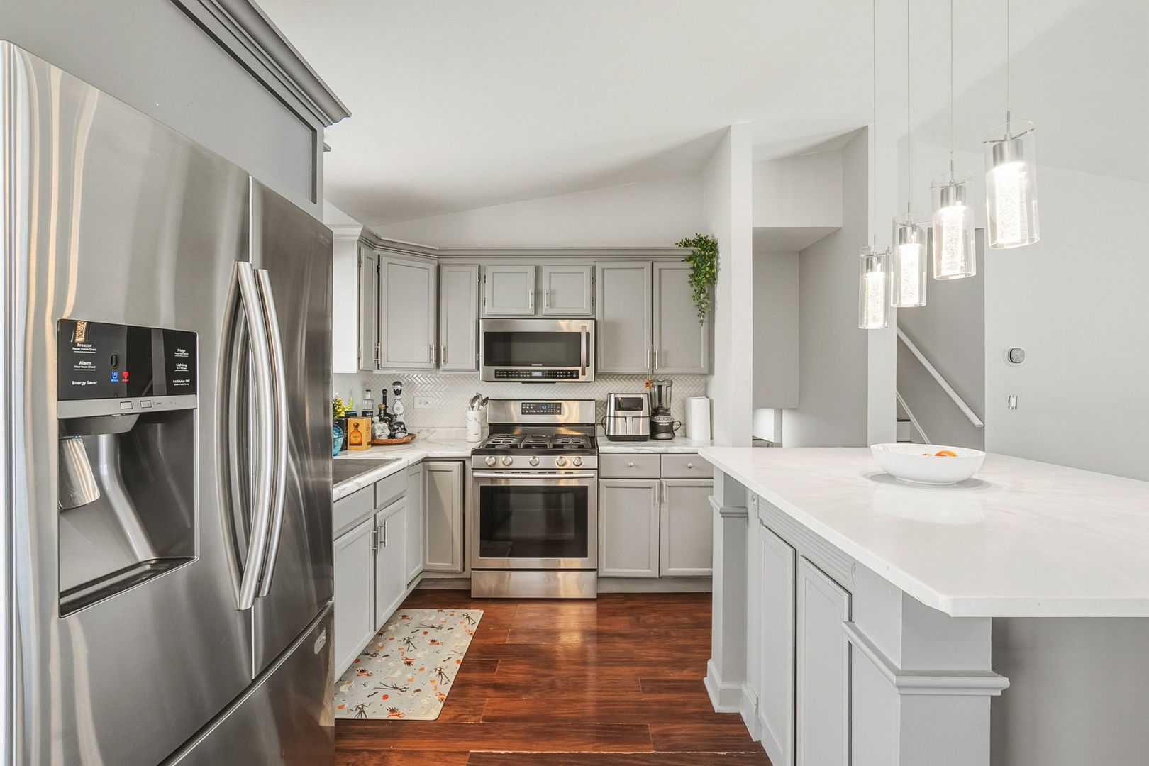 3668 Grandview Avenue Gurnee, IL 60031 - Photo 9 of 25 a kitchen with stainless steel appliances granite countertop a refrigerator sink and stove