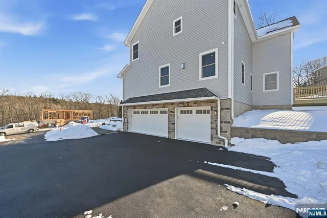 a view of a street with a building in the background