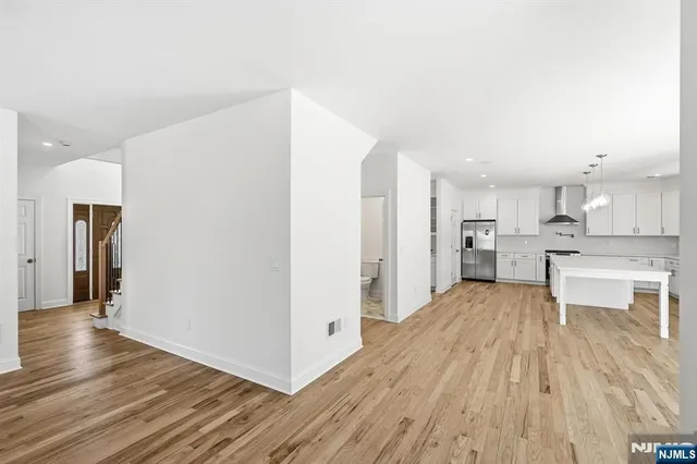 a view of kitchen with wooden floor