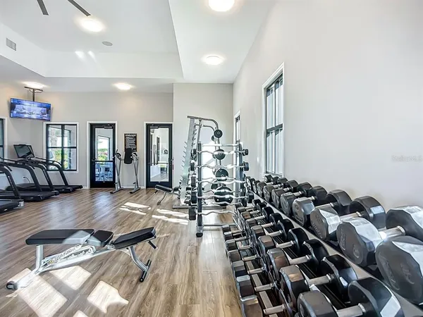 a kitchen with lots of counter top space and furniture