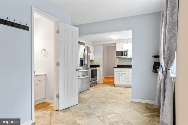 a view of a bathroom with a tub shower and windows