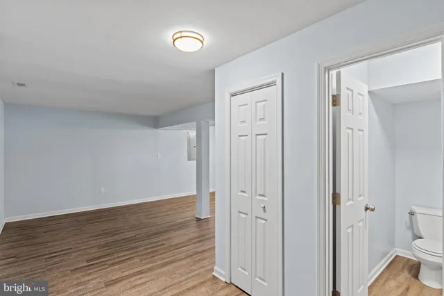 a view of a bathroom with wooden floor