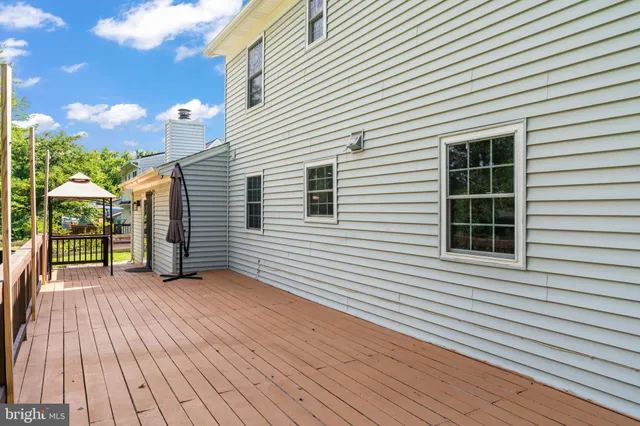 a view of backyard with a deck