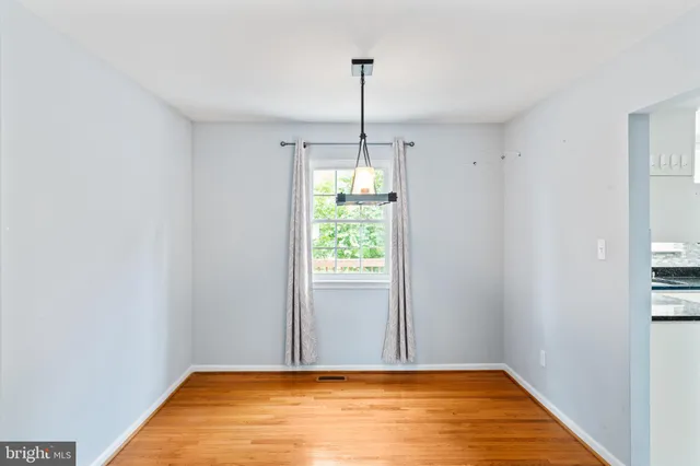 a view of room with window and entryway