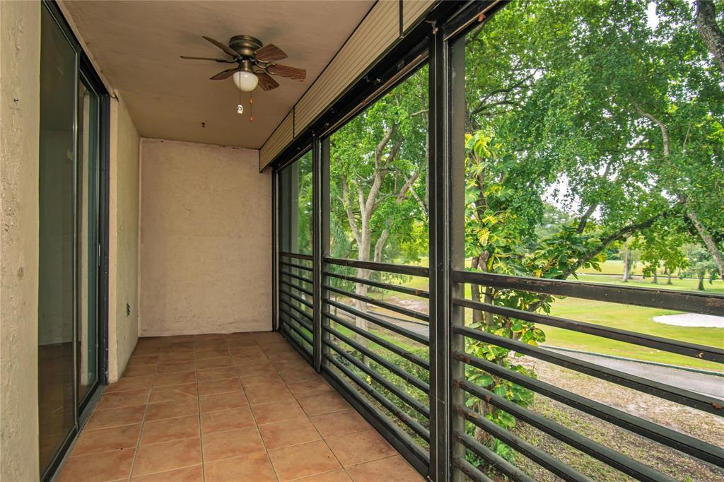 8150 West McNab Road, Unit 312 Tamarac, FL 33321 - Photo 16 of 32 a view of a porch with a tv
