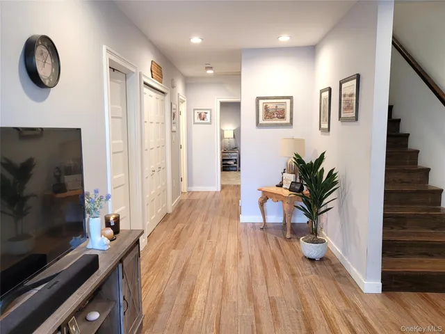 a view of a living room and wooden floor
