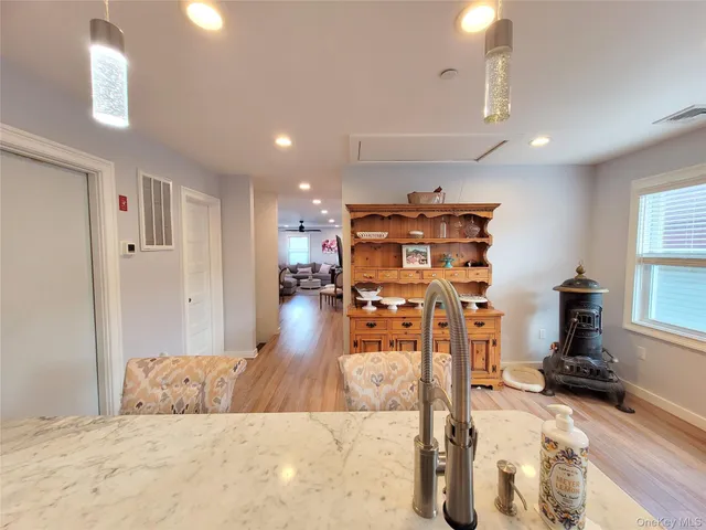 a view of a living room and kitchen