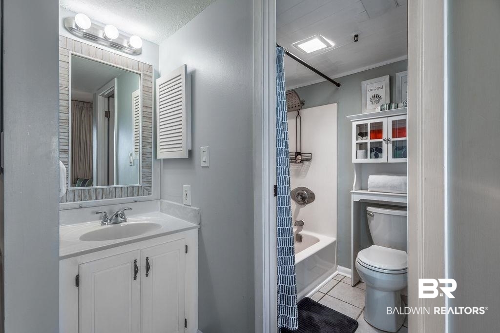 375 Plantation Road, Unit 5502 Gulf Shores, AL 36542 - Photo 10 of 27 The full bathroom features a tub/shower combo and toilet, with separate dressing area which includes a single vanity.