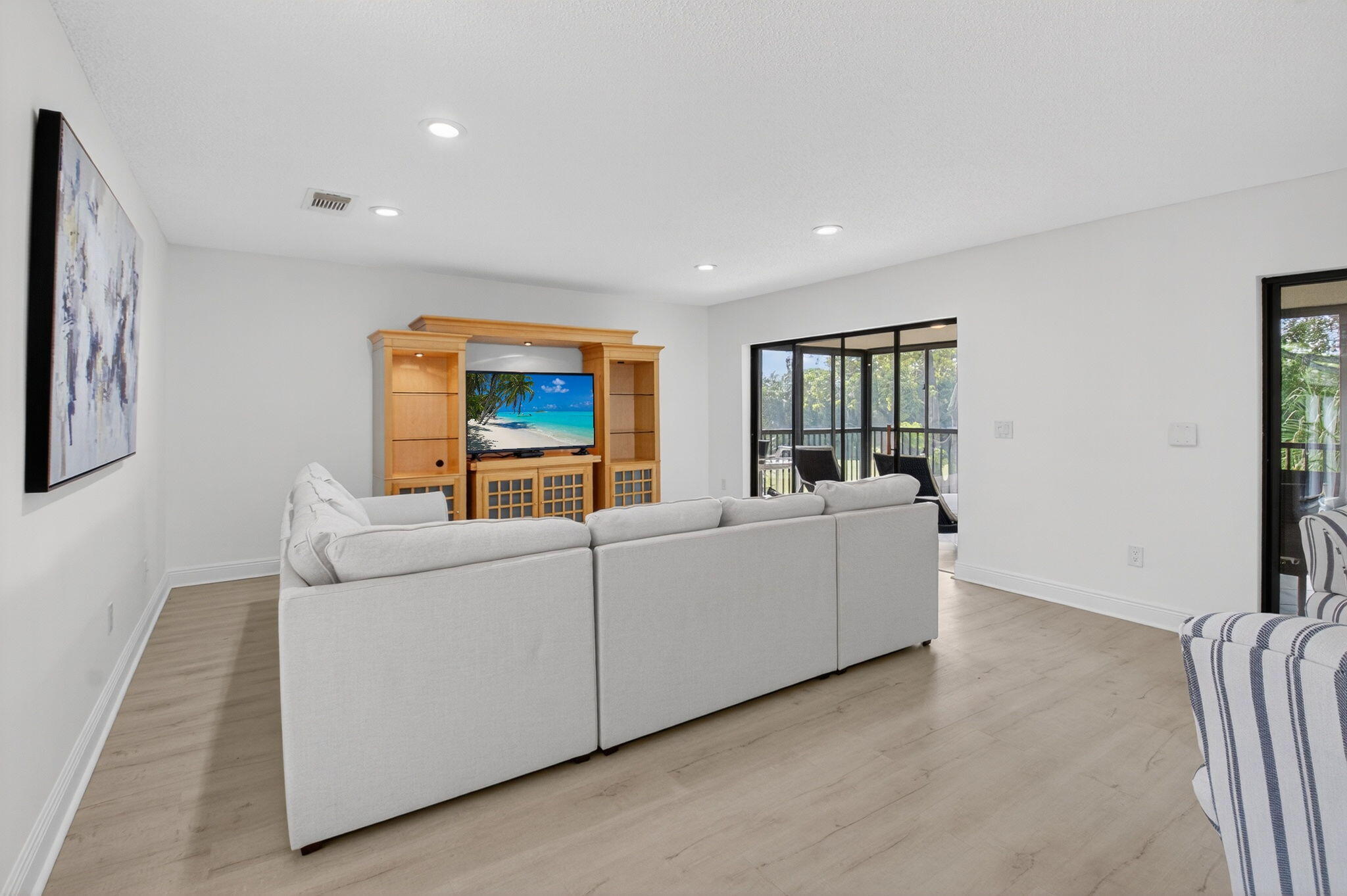 10 Southport Lane, Unit B Boynton Beach, FL 33436 - Photo 14 of 80 a living room with furniture and a flat screen tv