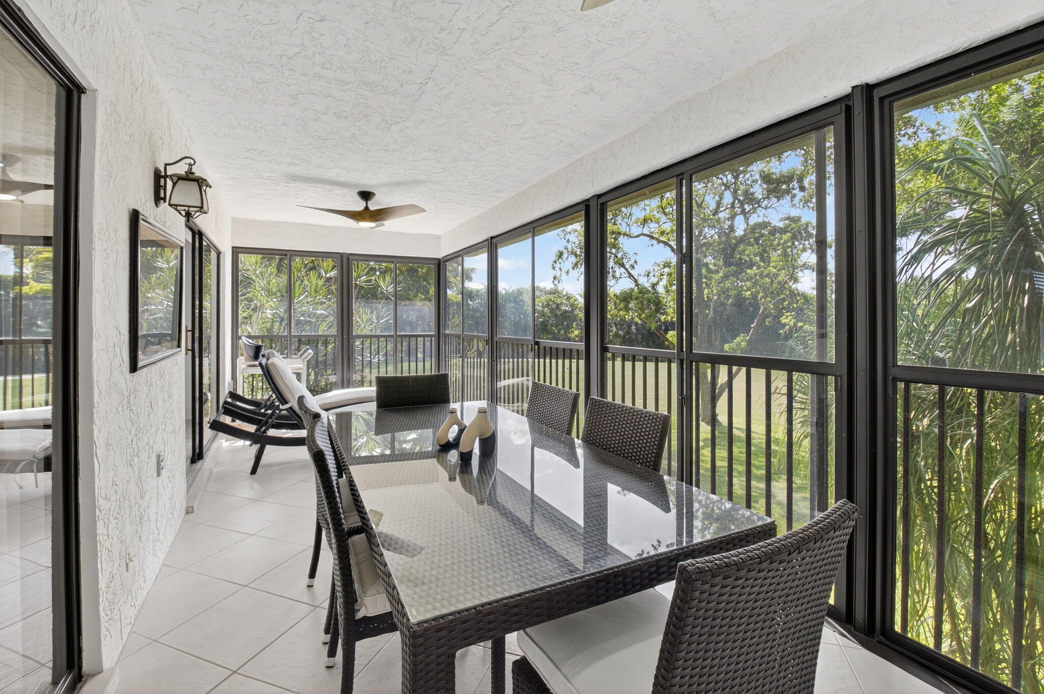 10 Southport Lane, Unit B Boynton Beach, FL 33436 - Photo 35 of 80 a view of a dining room with furniture large windows and wooden floor