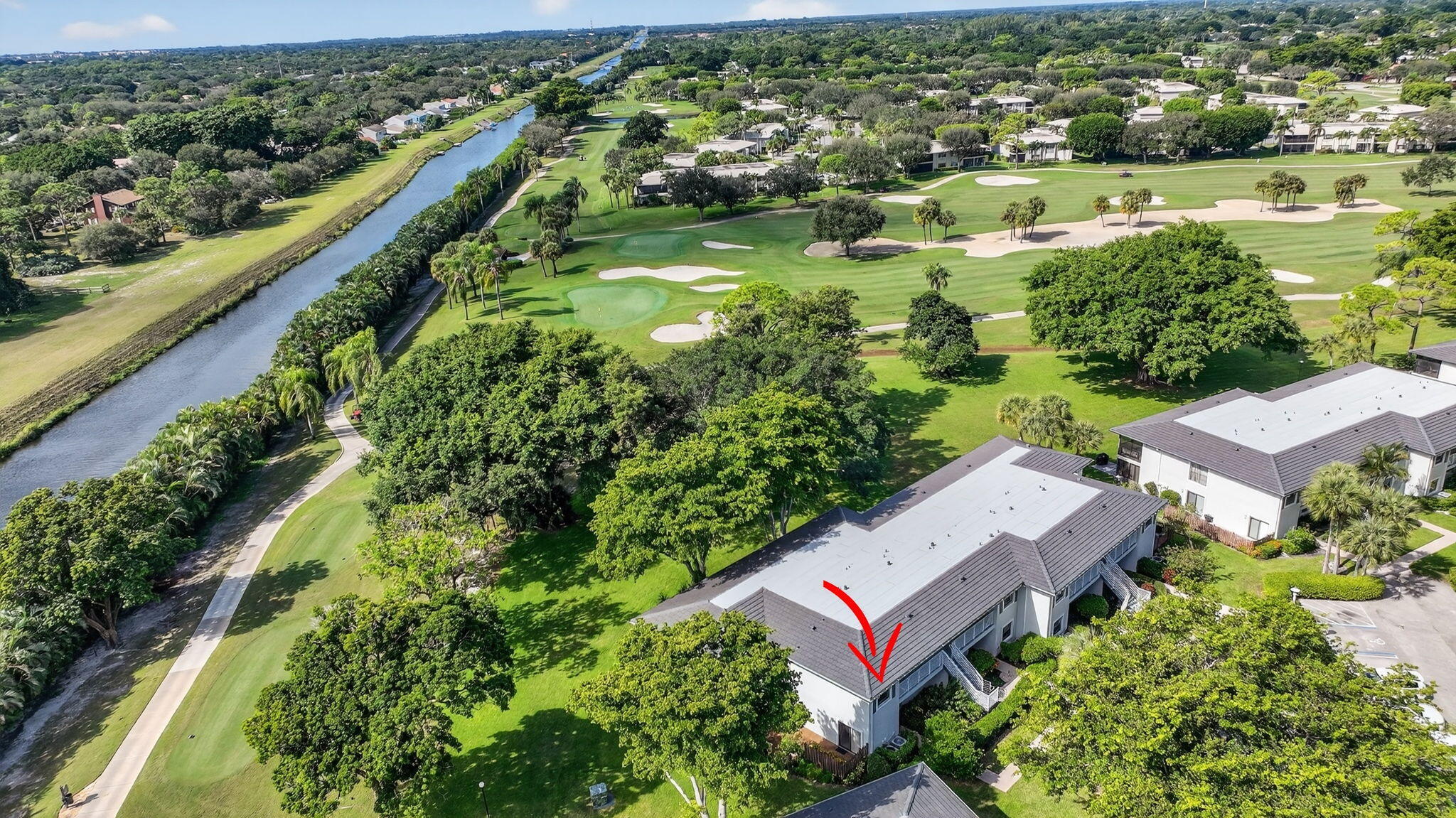10 Southport Lane, Unit B Boynton Beach, FL 33436 - Photo 42 of 80 an aerial view of a house with a garden and lake view