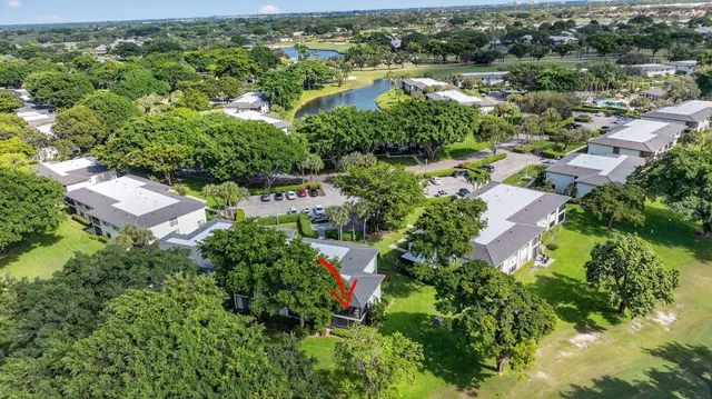 a view of a dining room with furniture and a kitchen