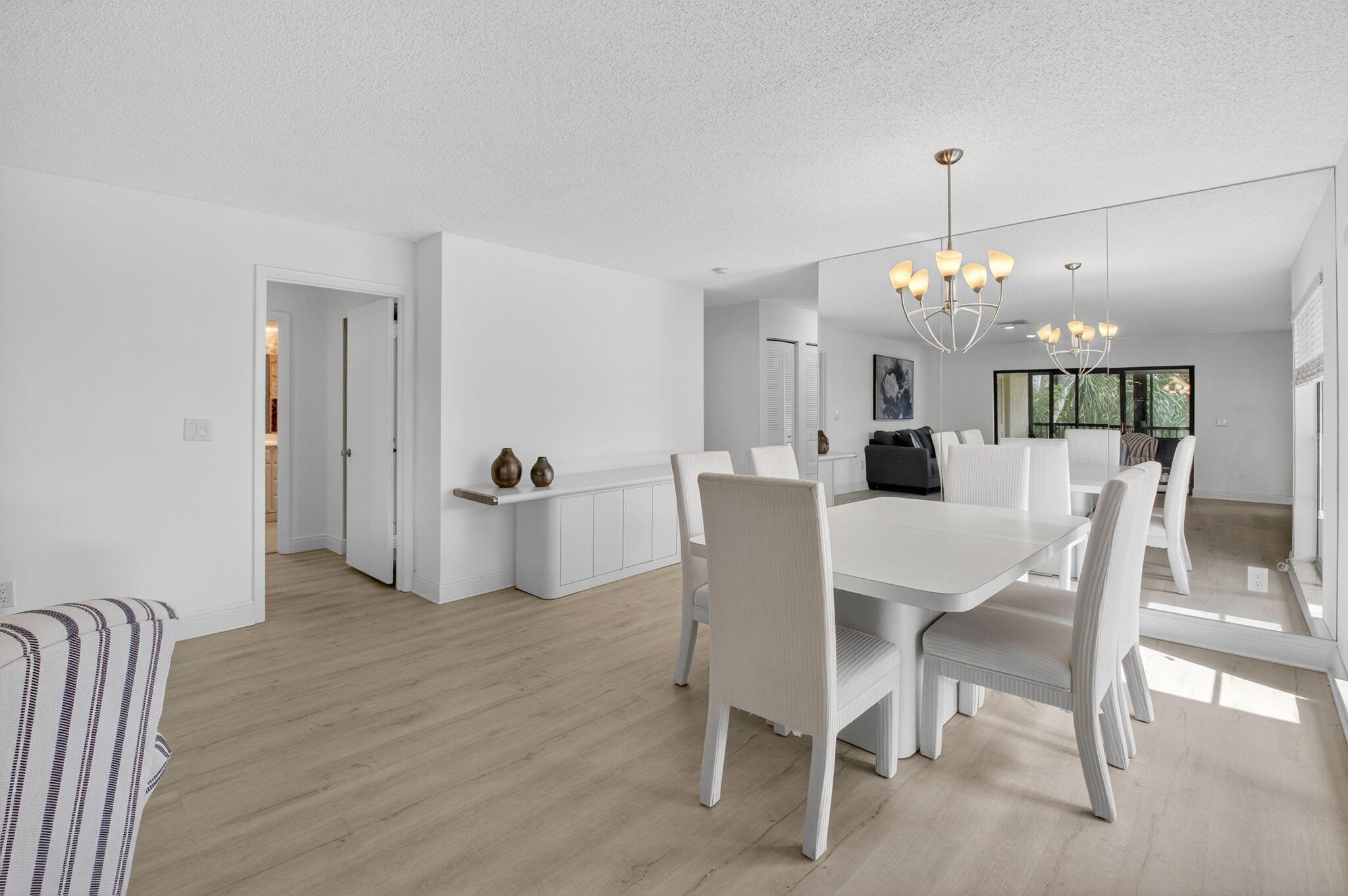 10 Southport Lane, Unit B Boynton Beach, FL 33436 - Photo 6 of 80 a view of a dining room with furniture and chandelier