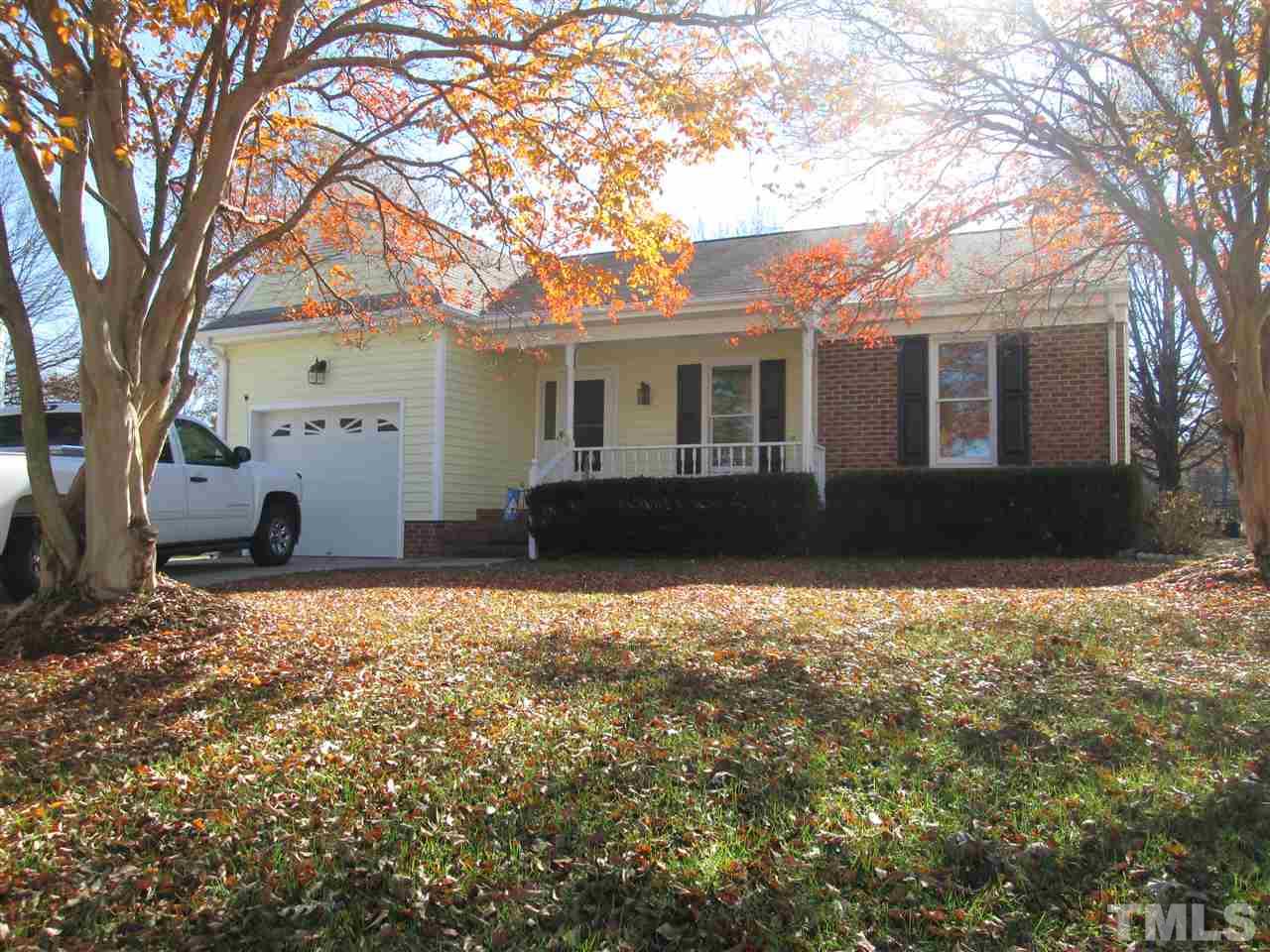 2600 Denbigh Court Raleigh, NC 27604 - Photo 1 of 13 a front view of a house with a yard and garage