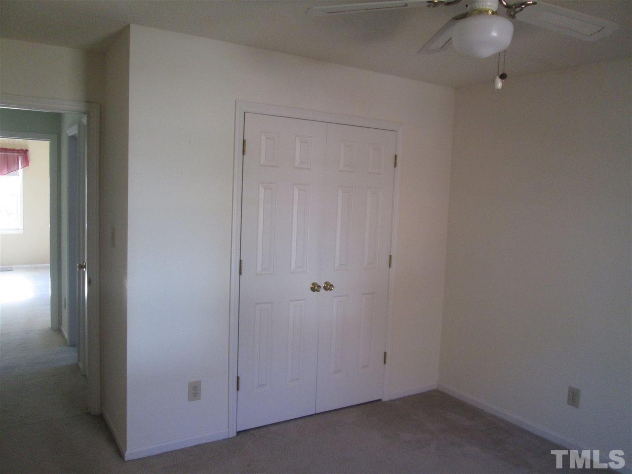 2600 Denbigh Court Raleigh, NC 27604 - Photo 13 of 13 an empty room with a ceiling fan