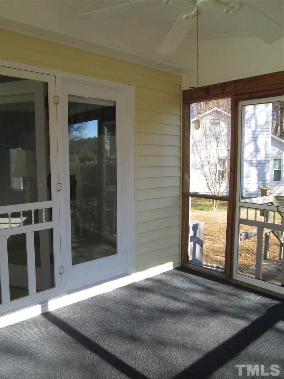 2600 Denbigh Court Raleigh, NC 27604 - Photo 3 of 13 a view of an entryway with a floor to ceiling window and an outdoor view
