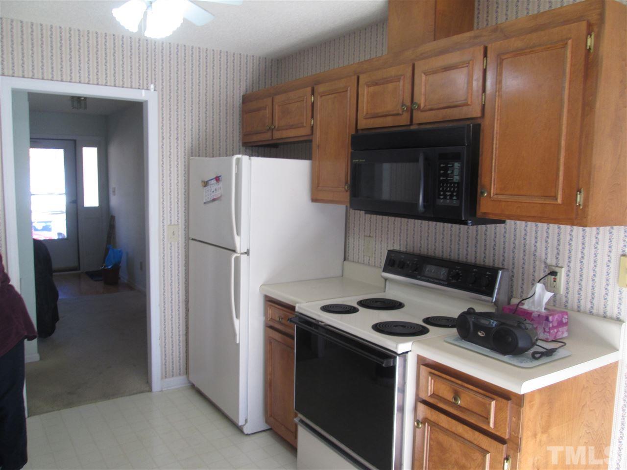2600 Denbigh Court Raleigh, NC 27604 - Photo 8 of 13 a kitchen with a stove and a refrigerator