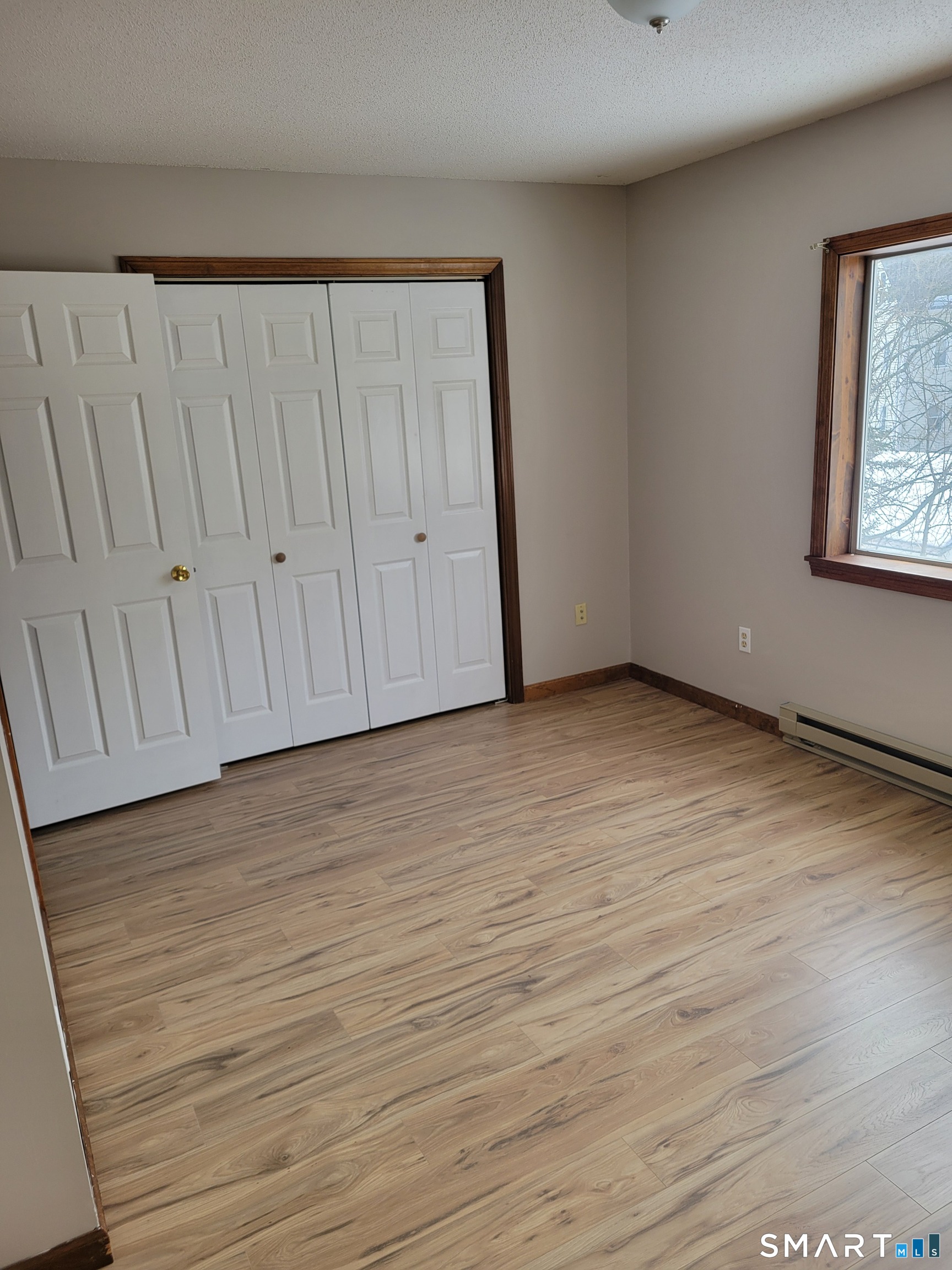 32 Stanley Street Naugatuck, CT 06770 - Photo 17 of 25 a view of an empty room with wooden floor