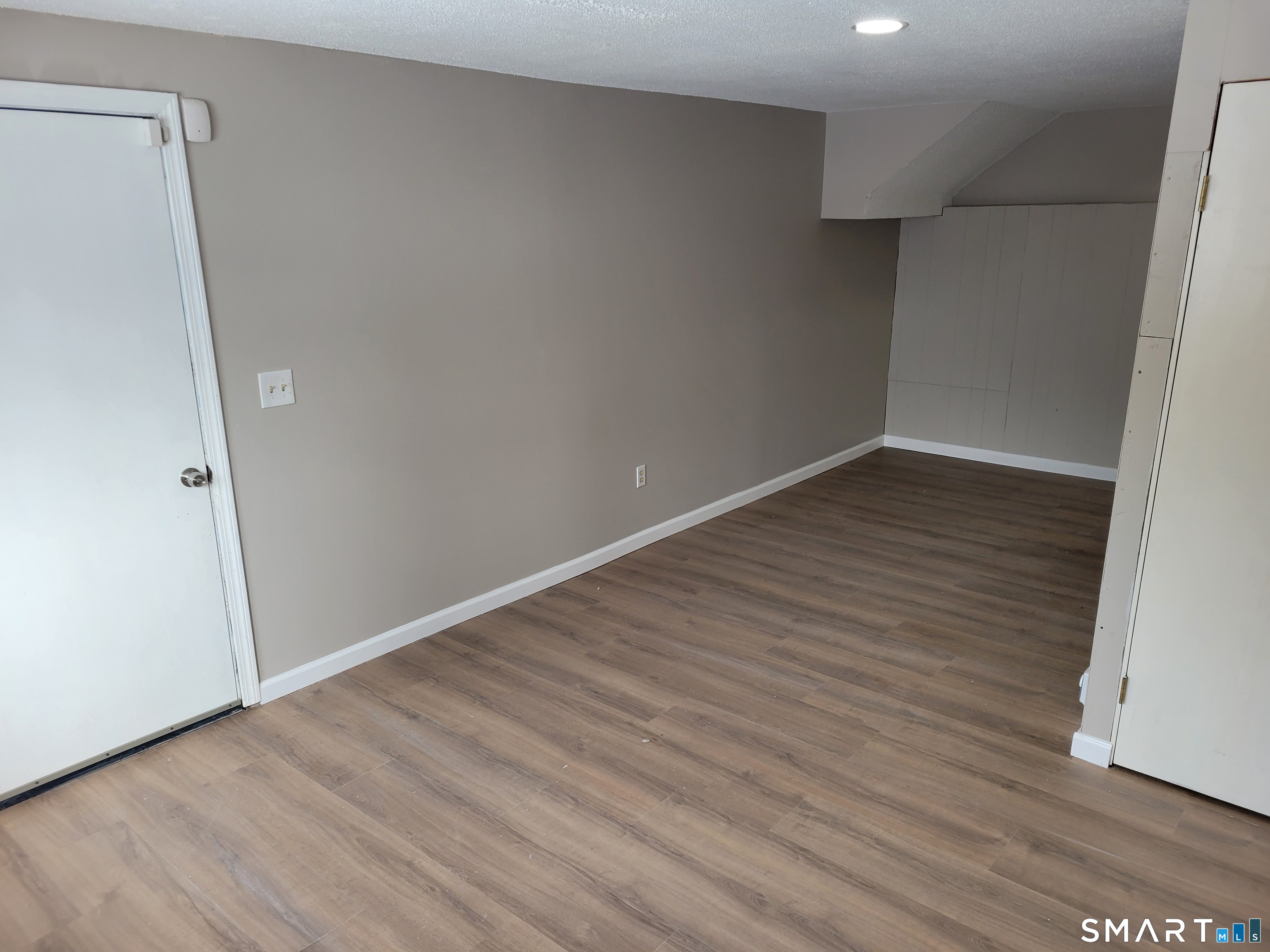 32 Stanley Street Naugatuck, CT 06770 - Photo 21 of 25 an empty room with wooden floor