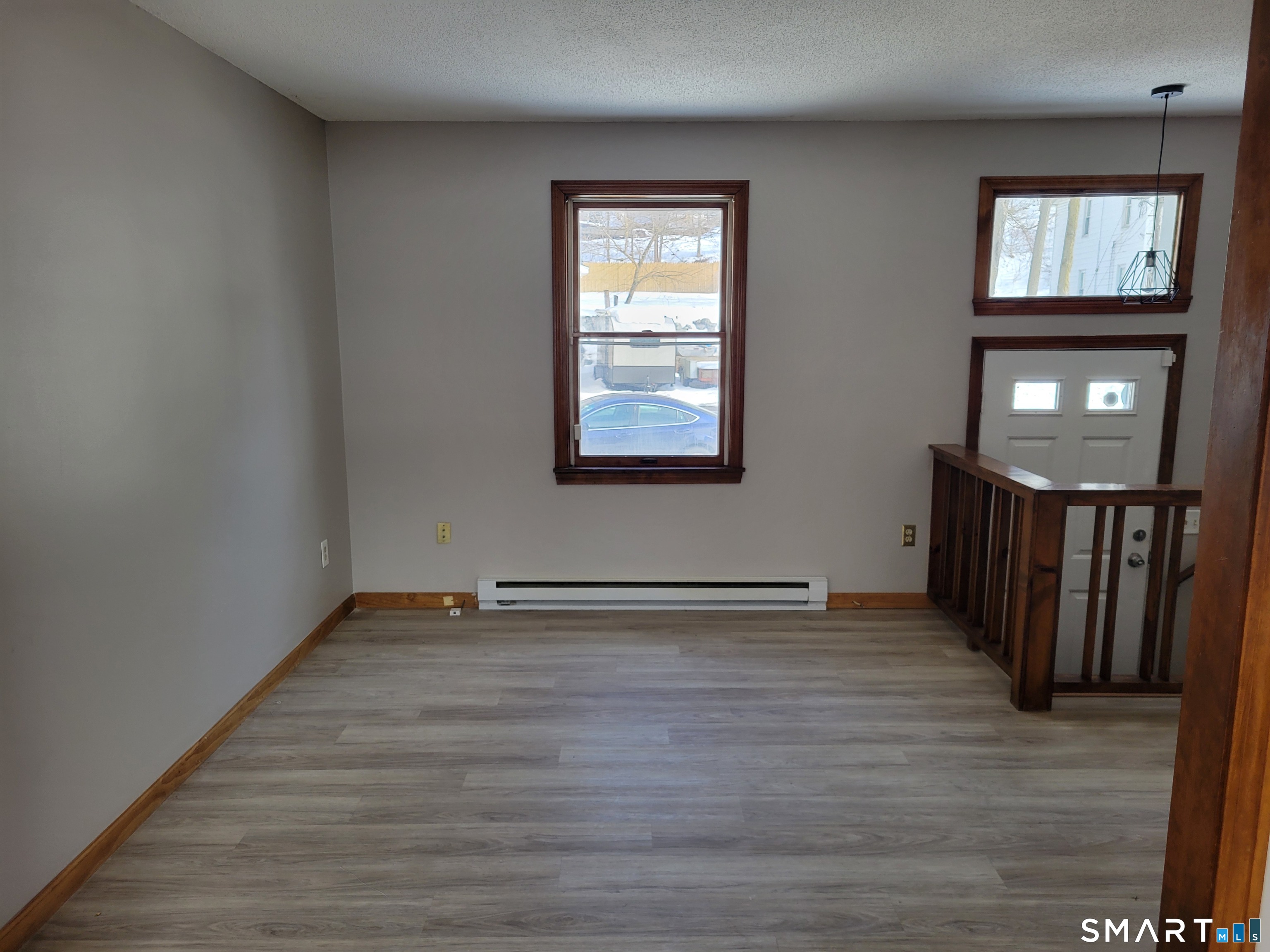 32 Stanley Street Naugatuck, CT 06770 - Photo 4 of 25 a view of an empty room with wooden floor and a window