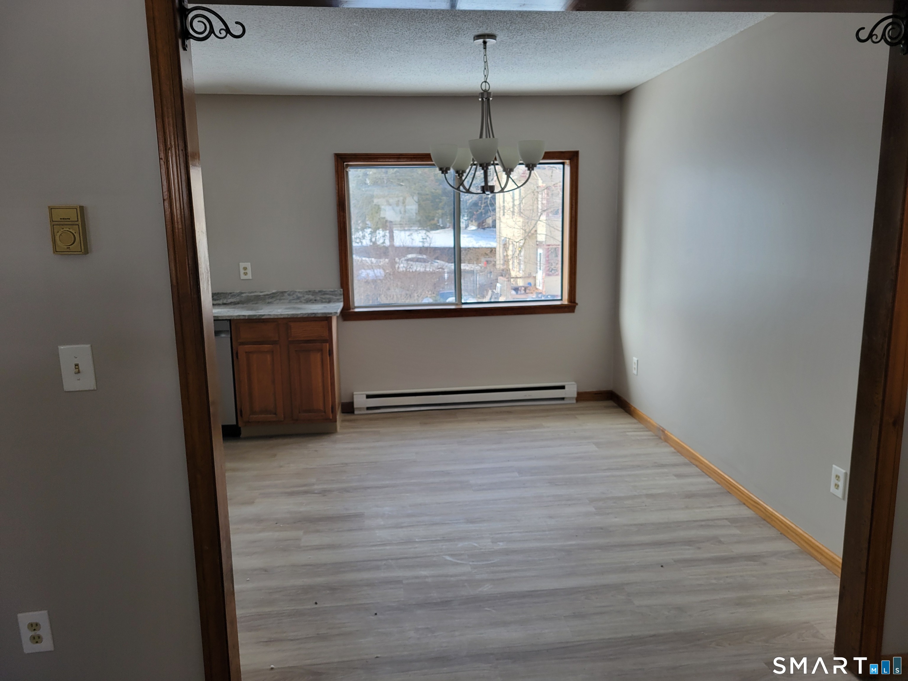 32 Stanley Street Naugatuck, CT 06770 - Photo 5 of 25 wooden floor in an empty room with a window