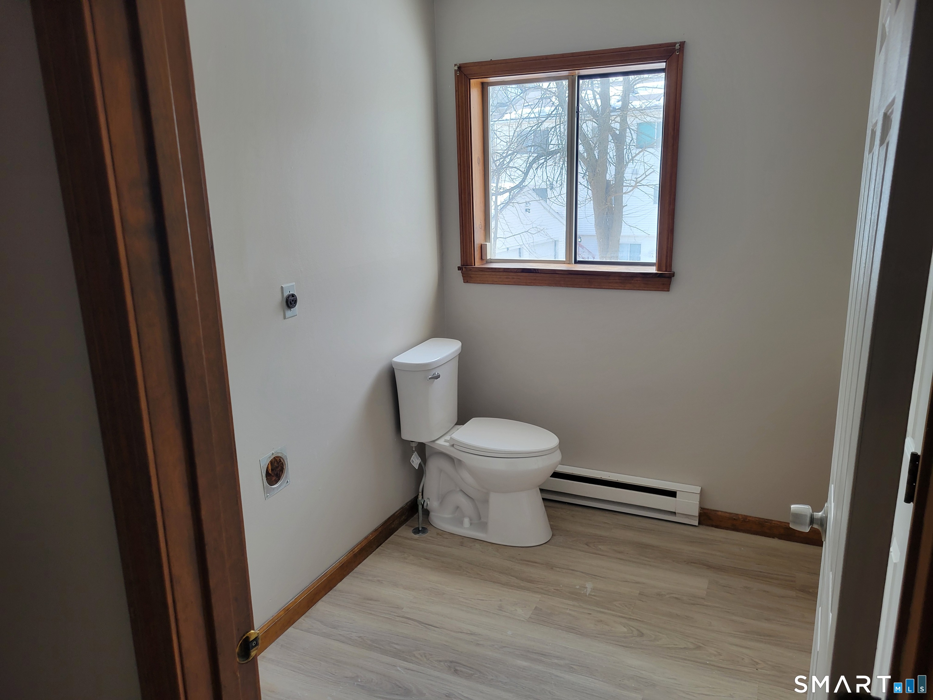 32 Stanley Street Naugatuck, CT 06770 - Photo 9 of 25 a white toilet sitting next to a bathroom sink