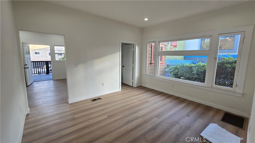 1040 Beacon Avenue, Unit 1040 Los Angeles, CA 90015 - Photo 2 of 8 wooden floor in an empty room with a window