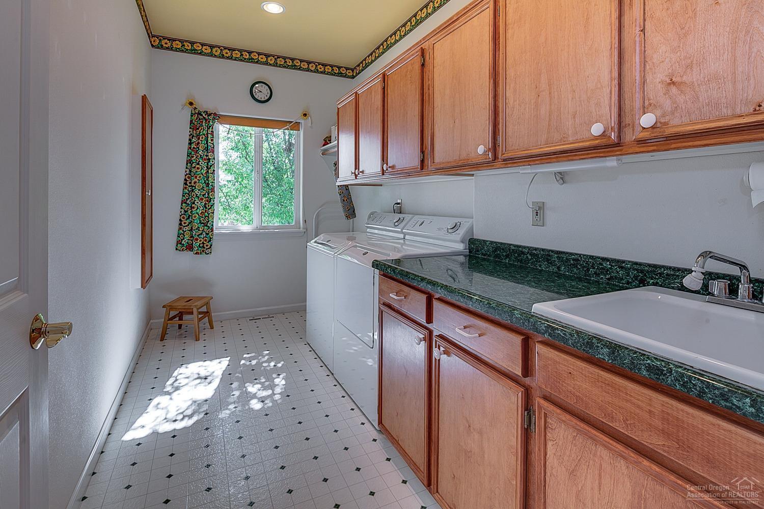 61116 Billadeau Road Bend, OR 97702 - Photo 19 of 25 Laundry room in main home with folding a