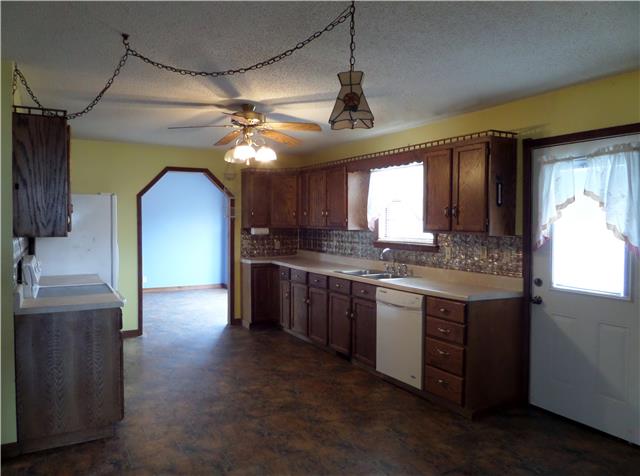 1299 Charley Davis Road Goodspring, TN 38460 - Photo 7 of 20 Nice Kitchen Cabinets with neutral tones and a view of the back property