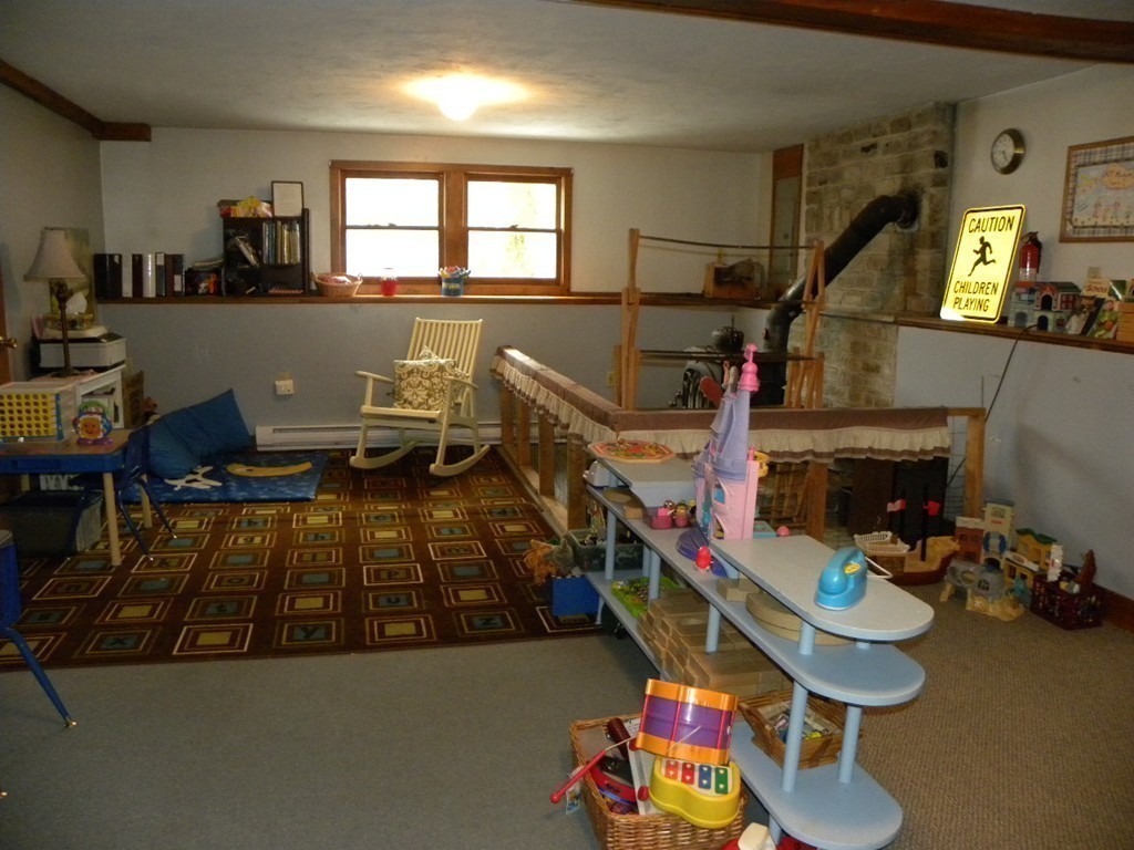 129 Old Worcester Road Charlton, MA 01507 - Photo 19 of 30 a bedroom with furniture and a wooden floor