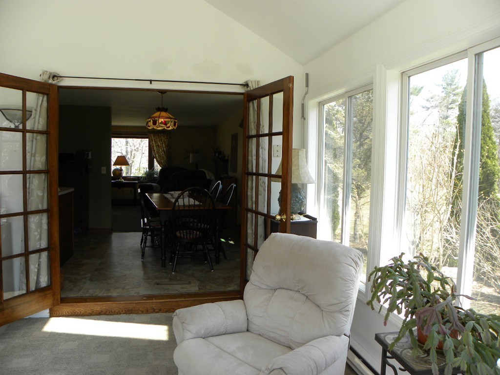 129 Old Worcester Road Charlton, MA 01507 - Photo 23 of 30 a living room with furniture and a potted plant