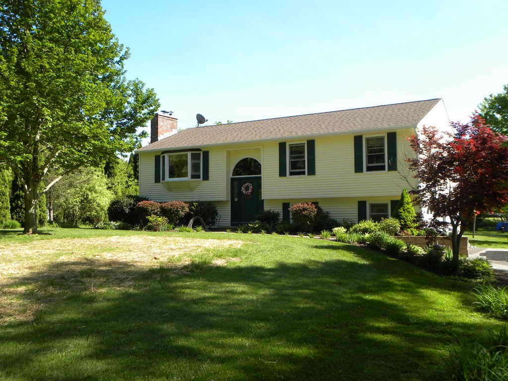 129 Old Worcester Road Charlton, MA 01507 - Photo 5 of 30 a front view of house with yard and green space