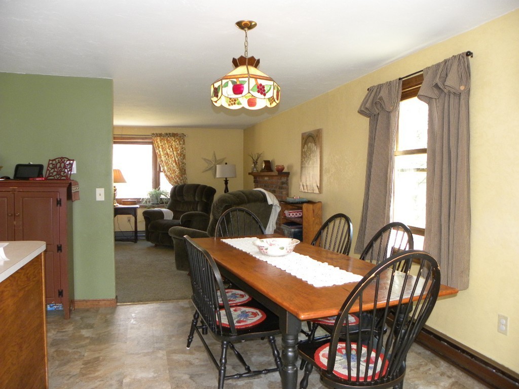 129 Old Worcester Road Charlton, MA 01507 - Photo 6 of 30 a dining room with furniture a livingroom and chandelier