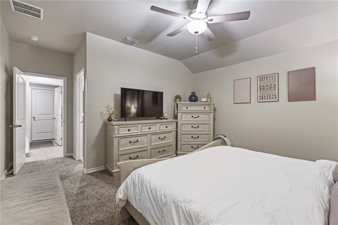 103 Donegal Street Sinton, TX 78387 - Photo 19 of 29 a bedroom with a bed and a flat screen tv