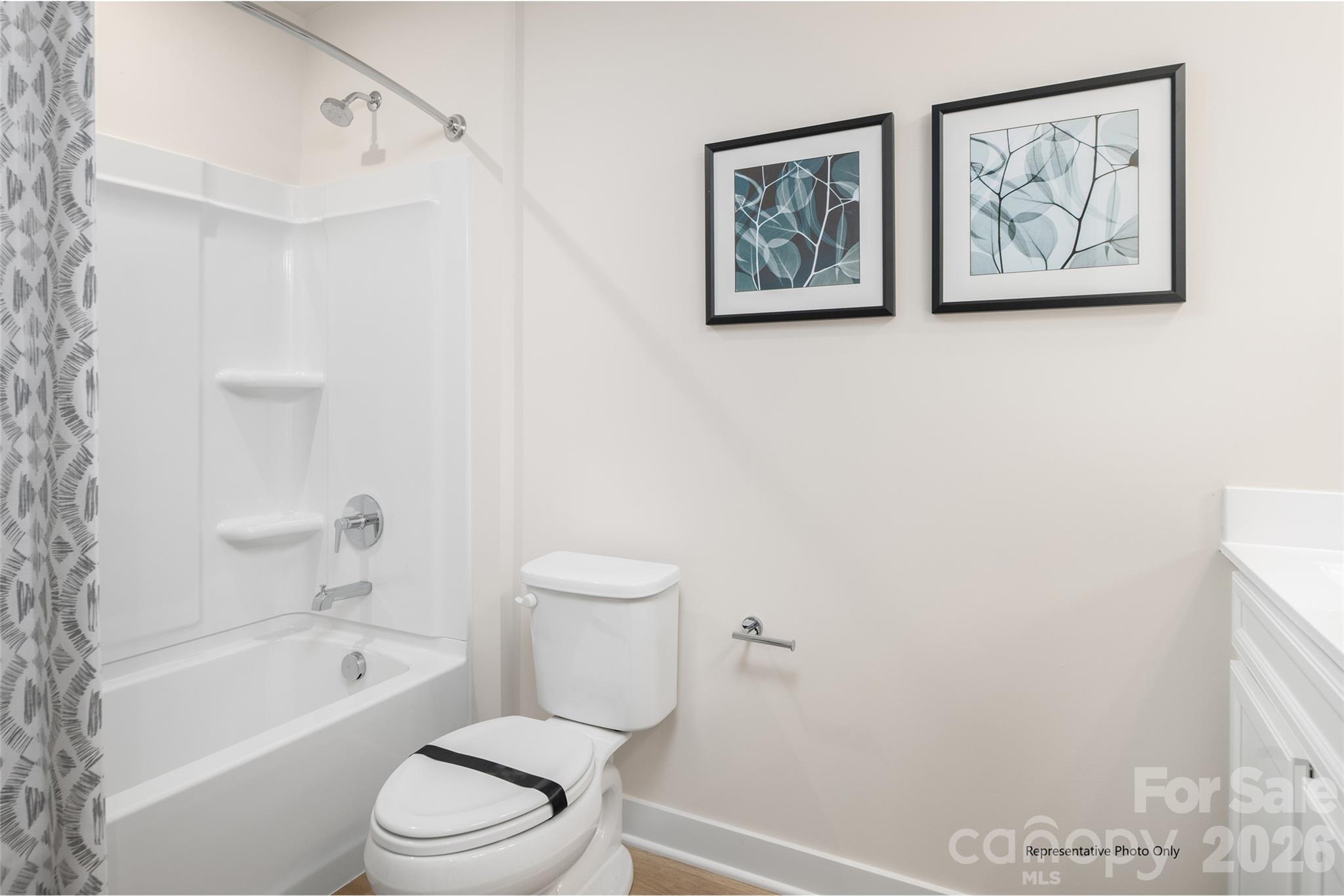 1029 Bracken Hill Road Indian Trail, NC 28079 - Photo 12 of 28 a white toilet sitting next to a bath tub