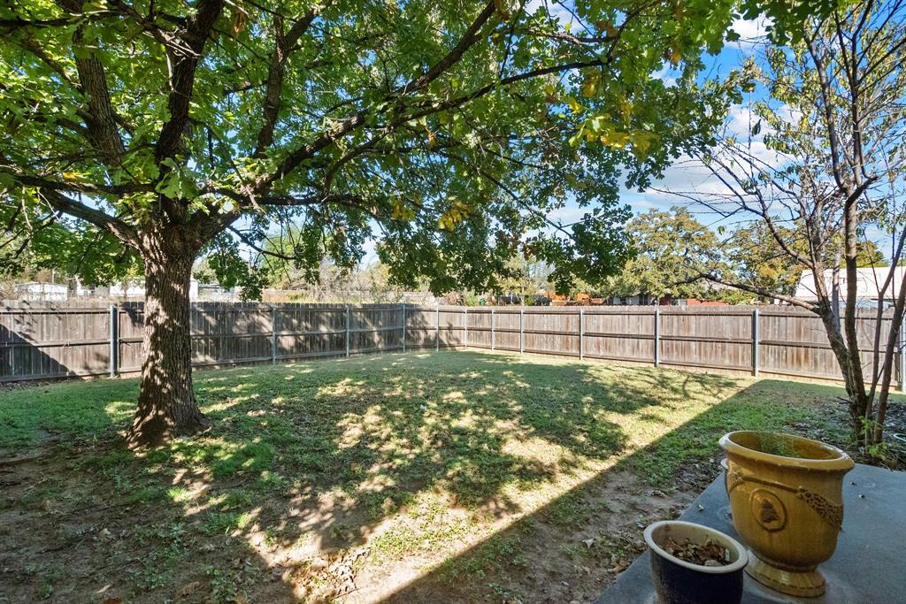 1155 Cage Street Stephenville, TX 76401 - Photo 5 of 38 a view of a backyard with pathway