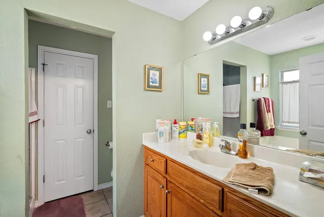 a bathroom with a sink double vanity and a mirror