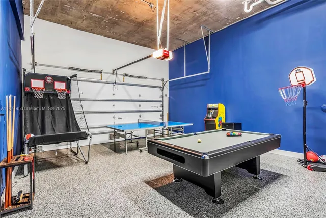 a front view of a house with a yard and potted plants